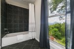 Main Level Master Bathroom En Suite with Separate Vanities & Shower Tub